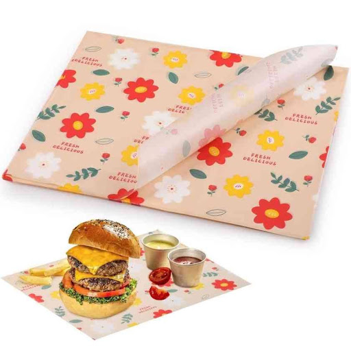 Alt Text: Custom printed deli paper featuring a colorful floral pattern with red, yellow, and white flowers,