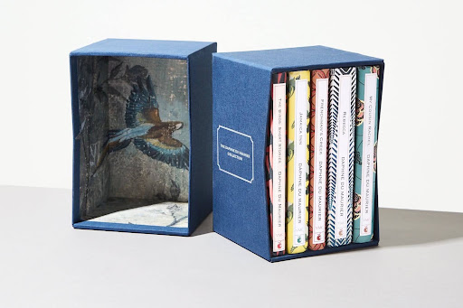 Custom printed book box featuring vibrant colors, bold graphics, and detailed artwork for book packaging.